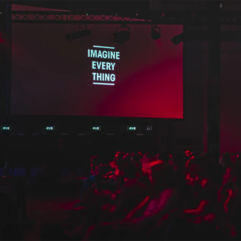 MASV-Portals-Global-Conference-Move-Thousands-Video-Imagine-Everything-Square Event hall with a large banner that reads imagine everything